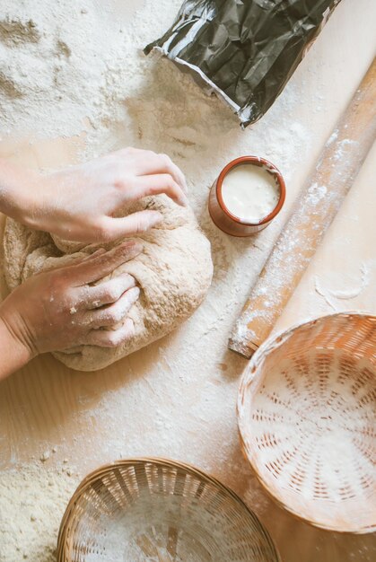 Hands preparing dough